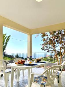 a dining room with a table and chairs at "Fifi House" in Estreito da Calheta