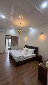 a bedroom with a large bed in a room at Al Fayz Boutique in Bukhara