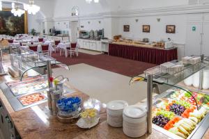 a buffet line with fruits and vegetables on display at Lázeňský Hotel Sadový Pramen in Karlovy Vary