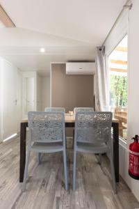 a dining room with a table and two chairs at Chez gaby in Lagorce