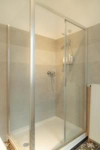 a shower with a glass door in a bathroom at Lyves in Liège +60 photos