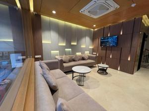 a living room with a couch and a table at Eve Hotel in Varanasi
