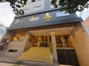 a building with yellow stairs in front of it at Eve Hotel in Varanasi