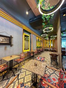 a restaurant with tables and chairs in a room at the Amara Hotel in Istanbul