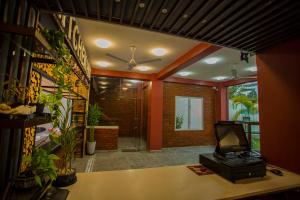 a room with a desk with a laptop on it at Superresidence in Balapitiya +109 photos
