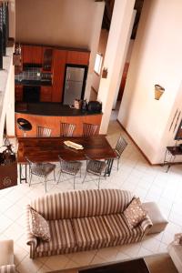 a living room with a couch and a table at 119 Zebula in Mabula