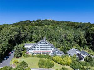 an aerial view of a building in the middle of a mountain at Sure Hotel by Best Western Rhoen Garden in Poppenhausen