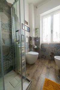 a bathroom with a shower and a tub and a sink at Di Giuseppe Laura in Ladispoli +20 photos