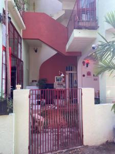 a red gate in front of a house at Tiny bright house Autum space in Danang