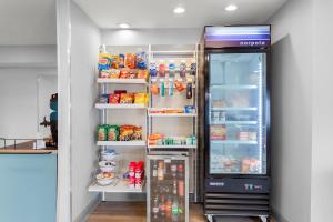 a refrigerator filled with lots of food and drinks at Spark by Hilton Matteson Chicago I 57 in Matteson +12 photos
