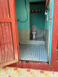 an open door to a bathroom with a toilet at Peace&Love in Ban Sôm