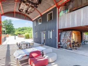 a building with a table and chairs and a table and chairs at Rusty Barn in Gloucester
