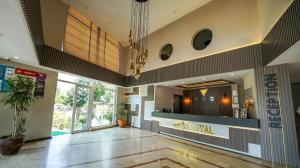 a lobby of a building with a bar in it at Nex Royal Beach in Antalya