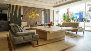 a living room with a table and two chairs at Nex Royal Beach in Antalya