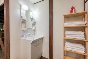 a bathroom with a sink and a mirror and towels at YAGARA TERRACE HOUSE OSAKA Room A in Osaka +27 photos