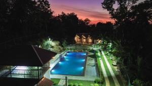 an overhead view of a swimming pool at night at Shalom Resort in Avissawella