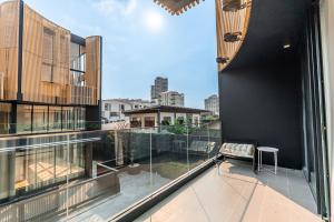 an apartment balcony with a view of the city at Heaven Thonglor 36 - Villa in Bangkok