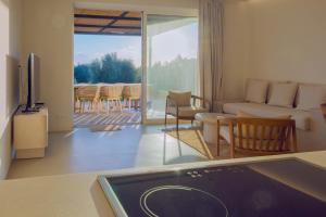a living room with a couch and a table at Villa Zeno in Tragána