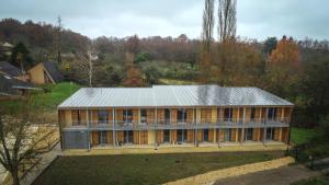 an aerial view of a large house in the woods at Résidences EMA-CNIFOP in Saint-Amand-en-Puisaye