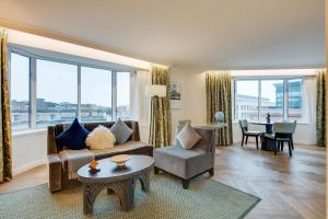 a living room with a couch and a table at Conrad Dublin in Dublin