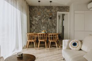 a living room with a table and chairs at Villa Morby in Paleros