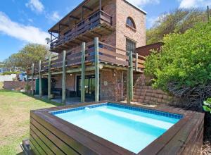 a house with a swimming pool in the yard at Hidden Gem in Cape Town