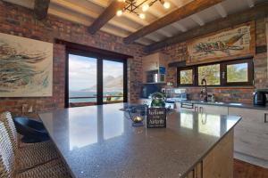 a kitchen with a large counter top in a room at Hidden Gem in Cape Town