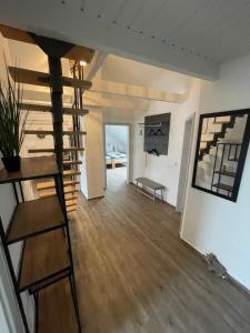 a living room with a staircase and a bench at B&K Immobilien GbR in Tangermünde