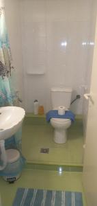 a bathroom with a toilet and a sink at elia patra apartment 2 in Patra +31 photos