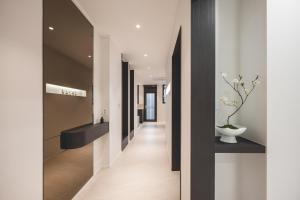 a hallway of a house with black and white walls at GOYURe 고유리 in Seoul