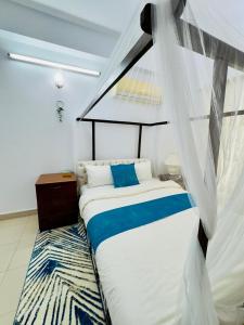 a bedroom with a bed with a canopy at Green House DHK in Dhaka