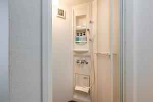 a bathroom with a shower in a room at YAGARA TERRACE HOUSE OSAKA Room D in Osaka