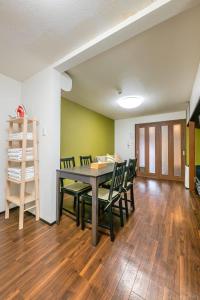 a dining room with a table and chairs at YAGARA TERRACE HOUSE OSAKA Room D in Osaka +31 photos