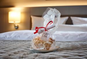 Postel nebo postele na pokoji v ubytování Sachsenpark-Hotel