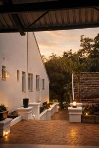 an outdoor patio with lights and a building at La Dukes Resort in Bushman Rock