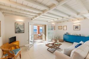 a living room with a couch and a table at Villino Gelli in Follonica