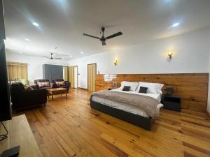 a bedroom with a bed and a living room at Pines Dirang Homestay in Chug +15 photos
