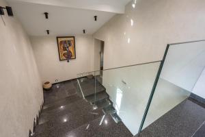 an empty hallway with a glass staircase in a building at Apartments Polejanov in Razlog