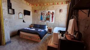 a bedroom with a bed in a room at Pyramids Mystery Inn in Cairo