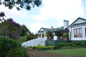an image of a house with a garden at Highgrove House Country Hotel, Restaurant, Farm & Spa in Hazyview