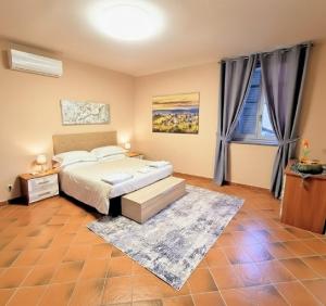 a bedroom with a bed and a large window at Palazzo Ciravegna, Alba Duomo View in Alba