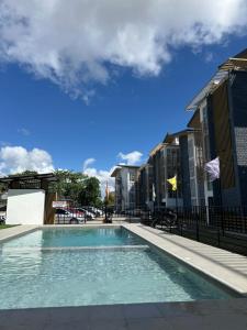 a swimming pool in the middle of a building at Bayanihan Flats 2 in Mactan