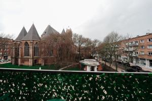 a building with a fountain in the middle of a city at Jungle Room Dunkerque centre in Dunkerque