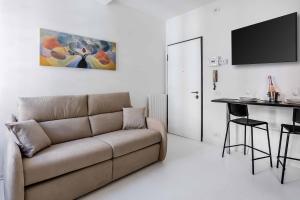 a living room with a couch and a table at Borgo Riccio - Nice place in Parma in Parma