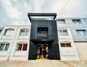 a building with a hotel sign on the front at Hotel Sun Loznica in Loznica