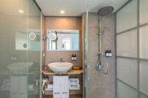 a bathroom with a sink and a shower at Barceló Santiago - Adults Only in Puerto de Santiago