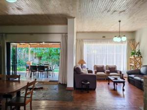a living room with a couch and a table at Zu Hause in Piet Retief