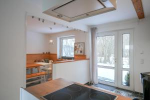 a kitchen with a sink and a counter top at Mor Mor Hus in Böhl