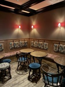 a restaurant with tables and chairs in a room at Hotel Bishops Arms Malmö in Malmö +37 photos