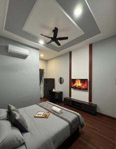 a bedroom with a bed and a ceiling fan at D'Anjung Cottage Paka in Paka
